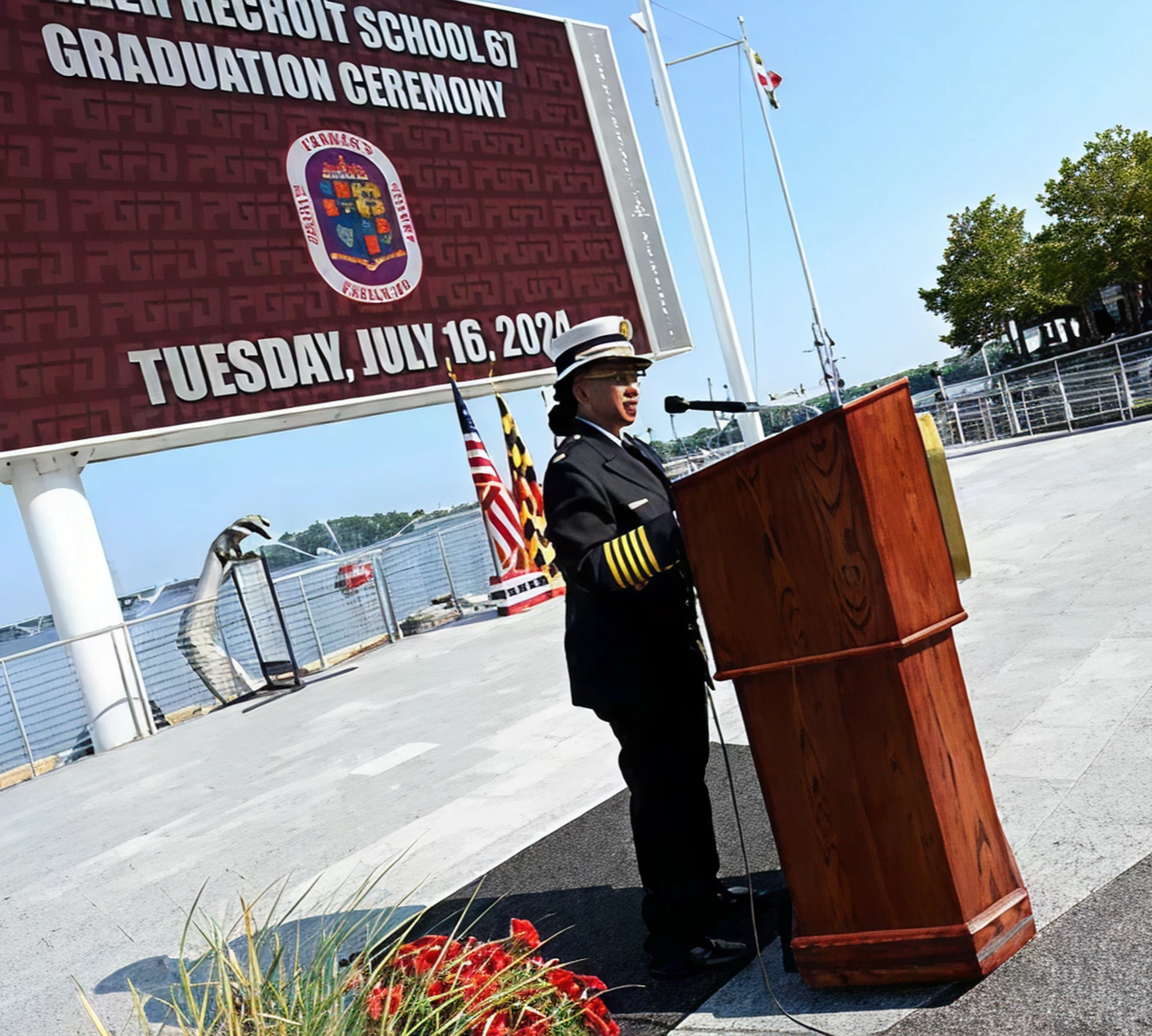 Officer speaking at graduation ceremony podium